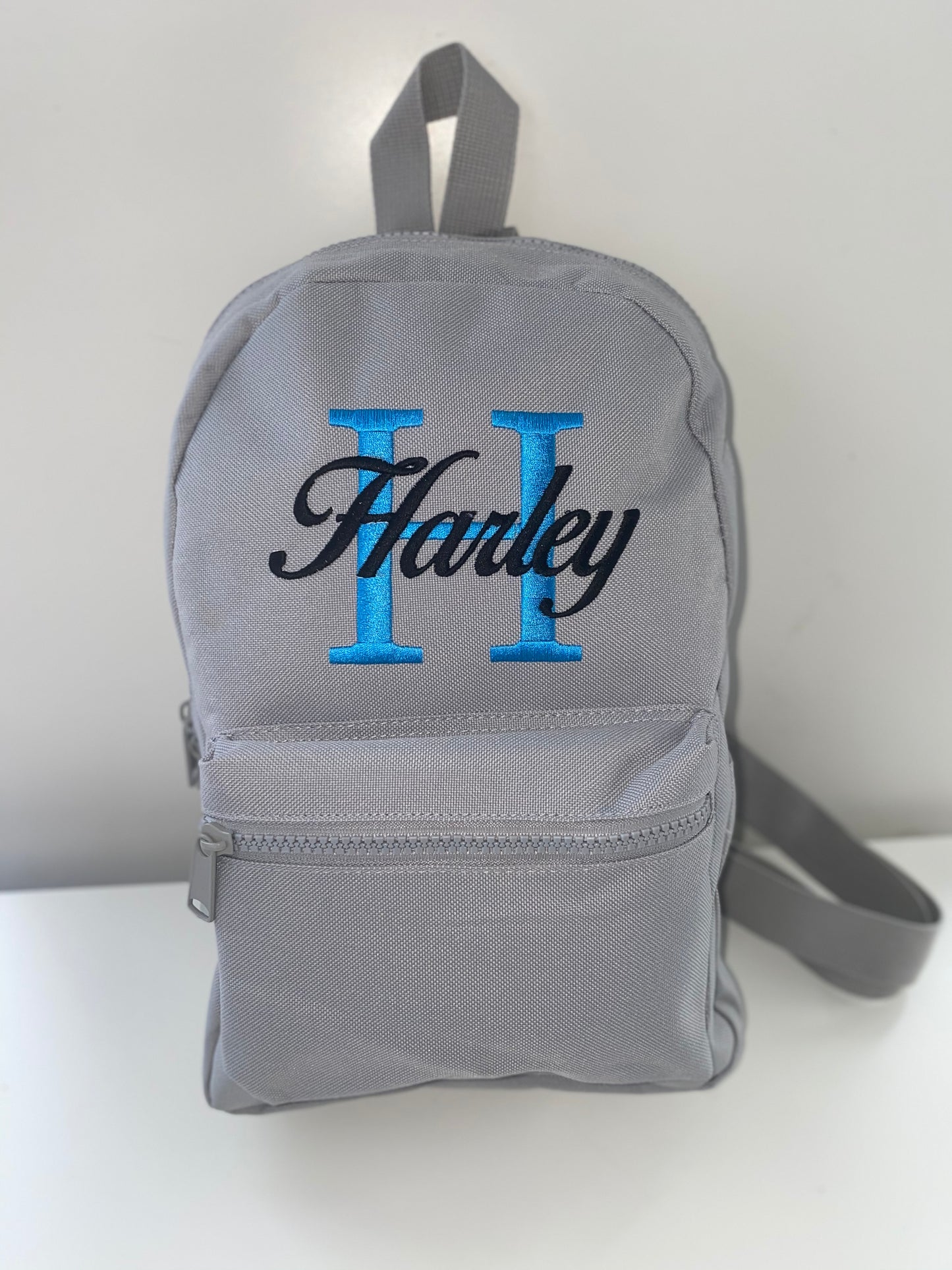Grey Embroidered Backpack - Bright Blue Initial - Black Birds of Paradise Font